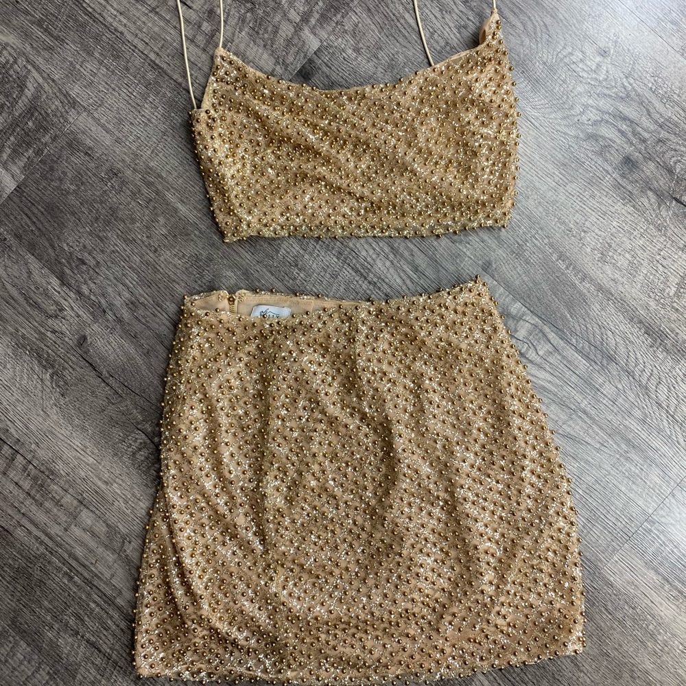 Gold crop top and skirt